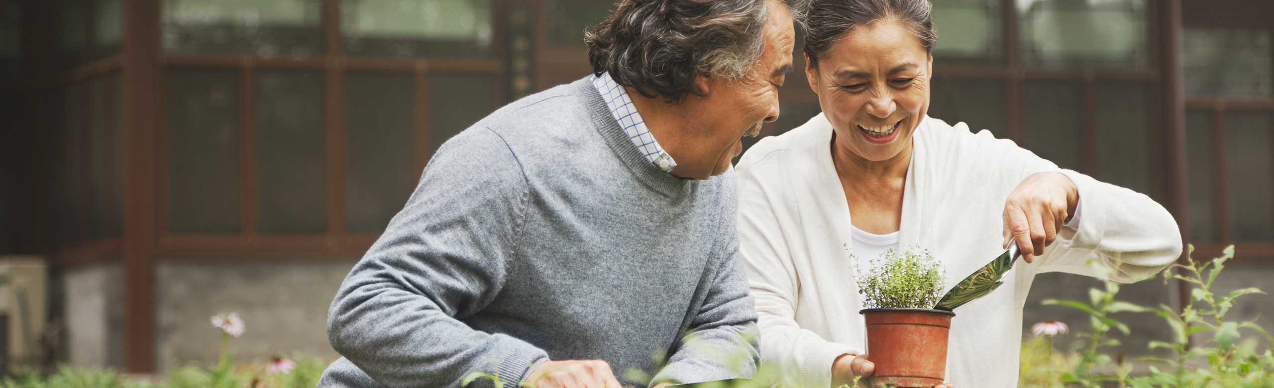 Couple gardening together outside