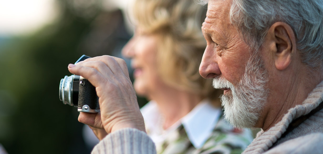 Man taking a photograph with a camera